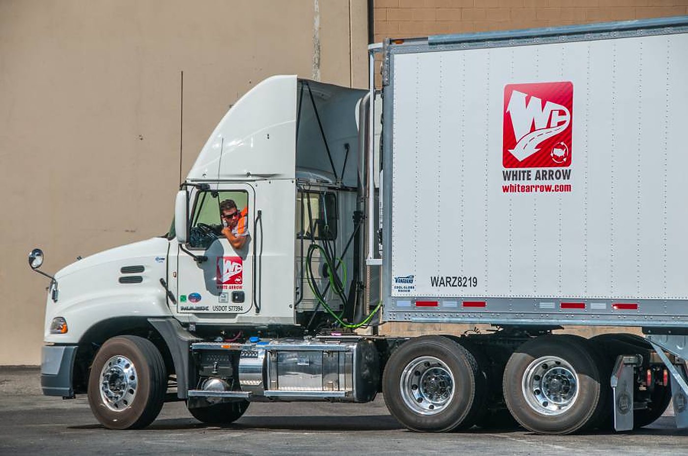 White Arrow tractors on the doors at a company terminal